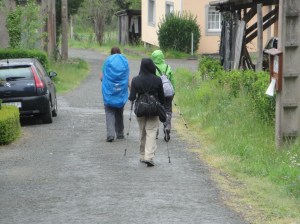 The girls walking walking under the dreary overcast skies.